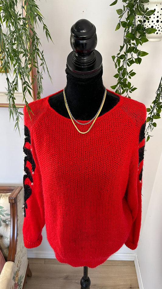 Red knit sweater with sequins on the sleeves - large